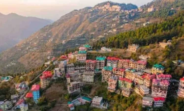 Scenic hillside view of Shimla with colorful houses and mountain landscape