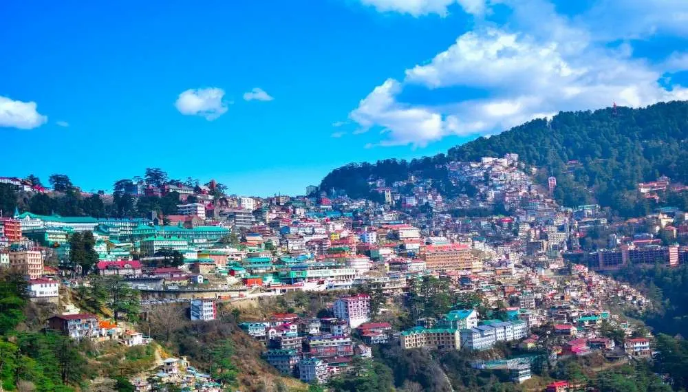 Best Honeymoon places in india in December Panoramic view of Shimla town on mountains”