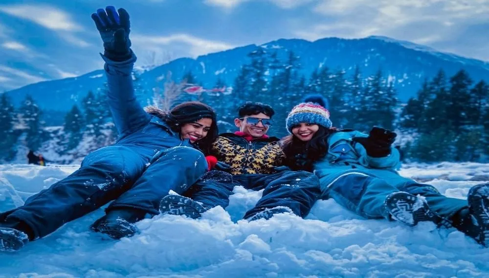 “Best honeymoon places in India couple enjoying snow in Manali”