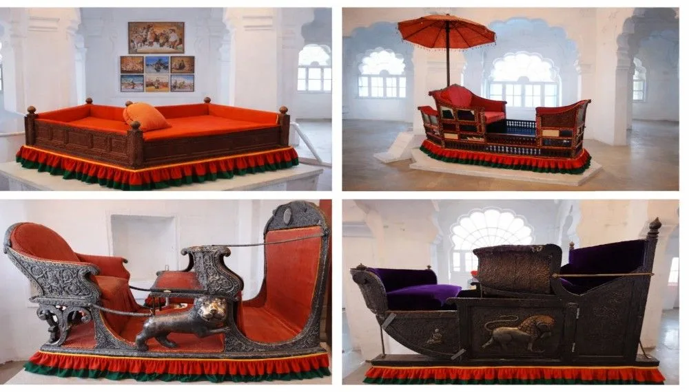 Collection of royal palanquins and traditional seating arrangements displayed inside Mehrangarh Fort museum in Jodhpur.