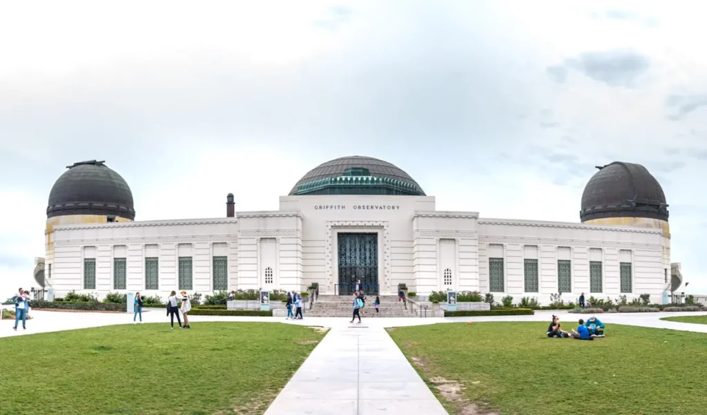 Griffith Observatory Los Angeles with visitors and city view on a clear day