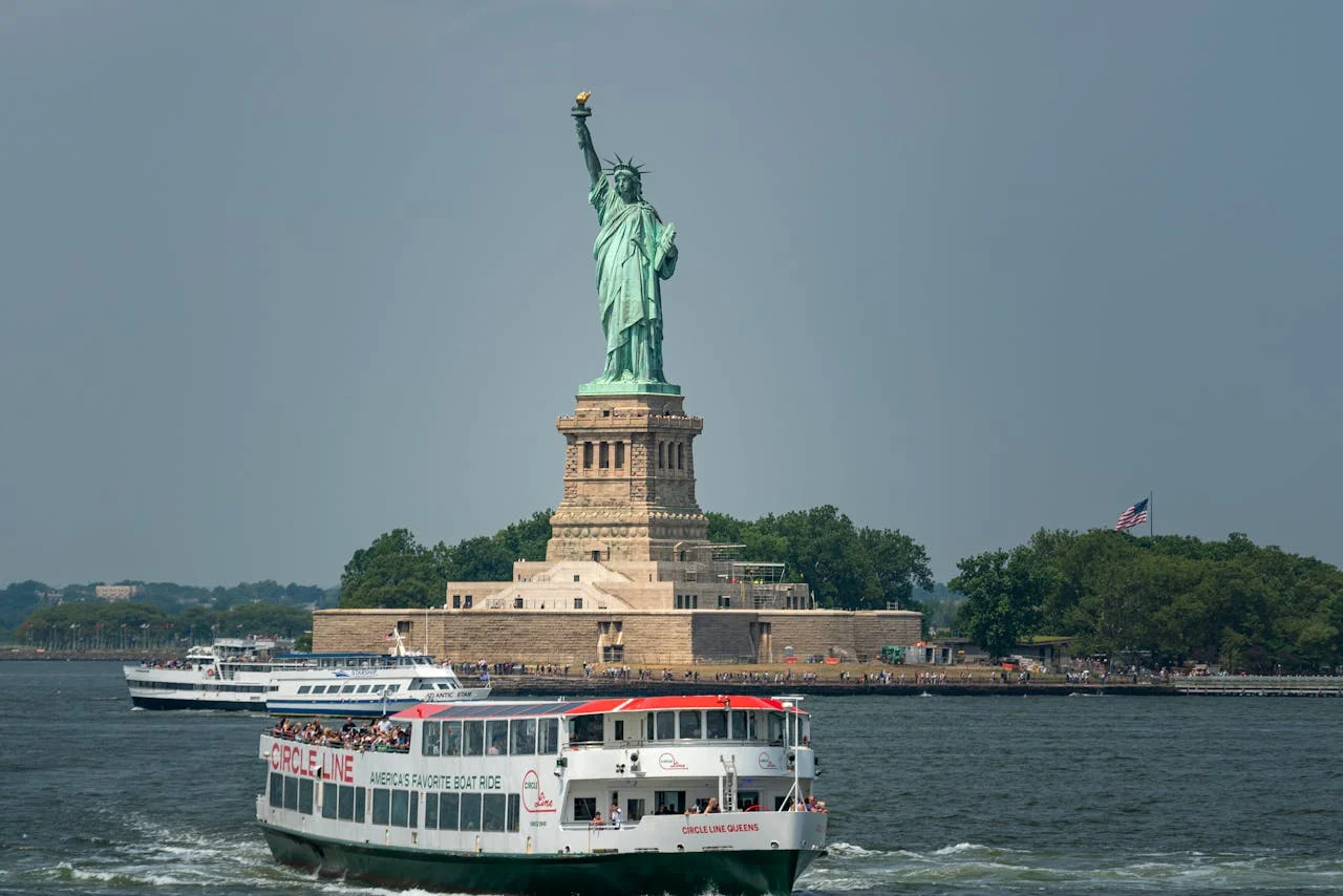 Statue of Liberty in New York with ferry boats – iconic USA landmark for budget travelers