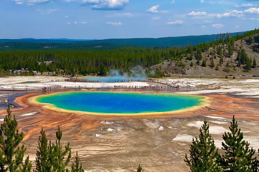 The vibrant colorful Grand Prismatic Spring pool, a must-see scenic spot when exploring the best national parks to visit in June.