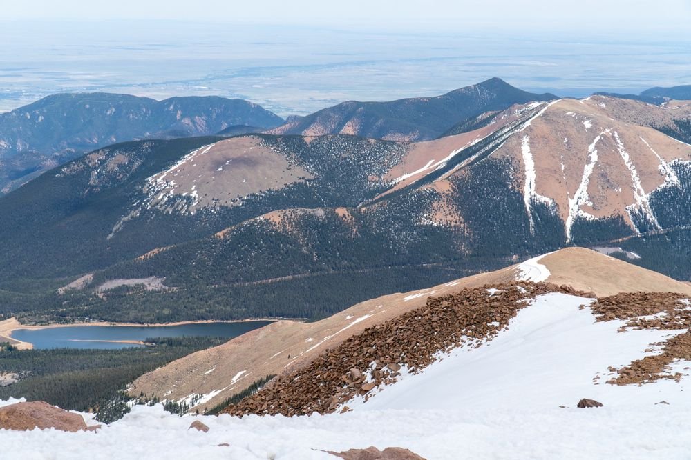 Panoramic mountain peaks and alpine lake view from Wheeler Peak trail in Great Basin National Park, making it one of the best national parks to visit in July.