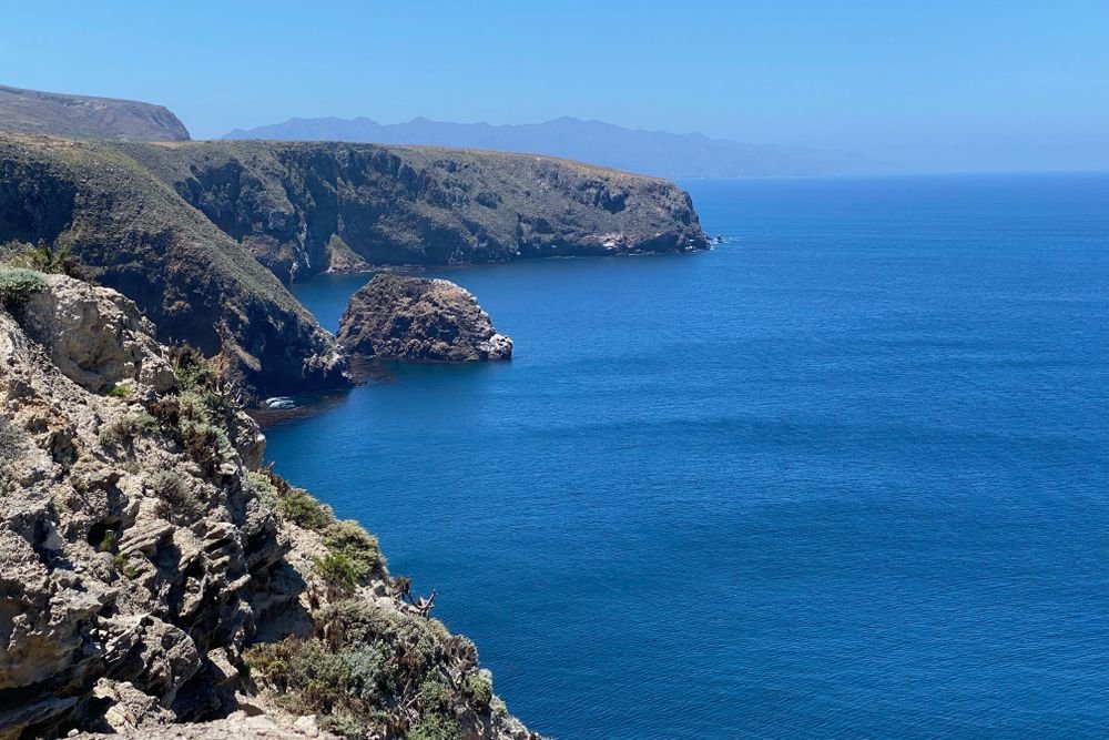 Dramatic ocean cliffs and deep blue waters of Santa Cruz Island at Channel Islands, one of the best national parks to visit in September.